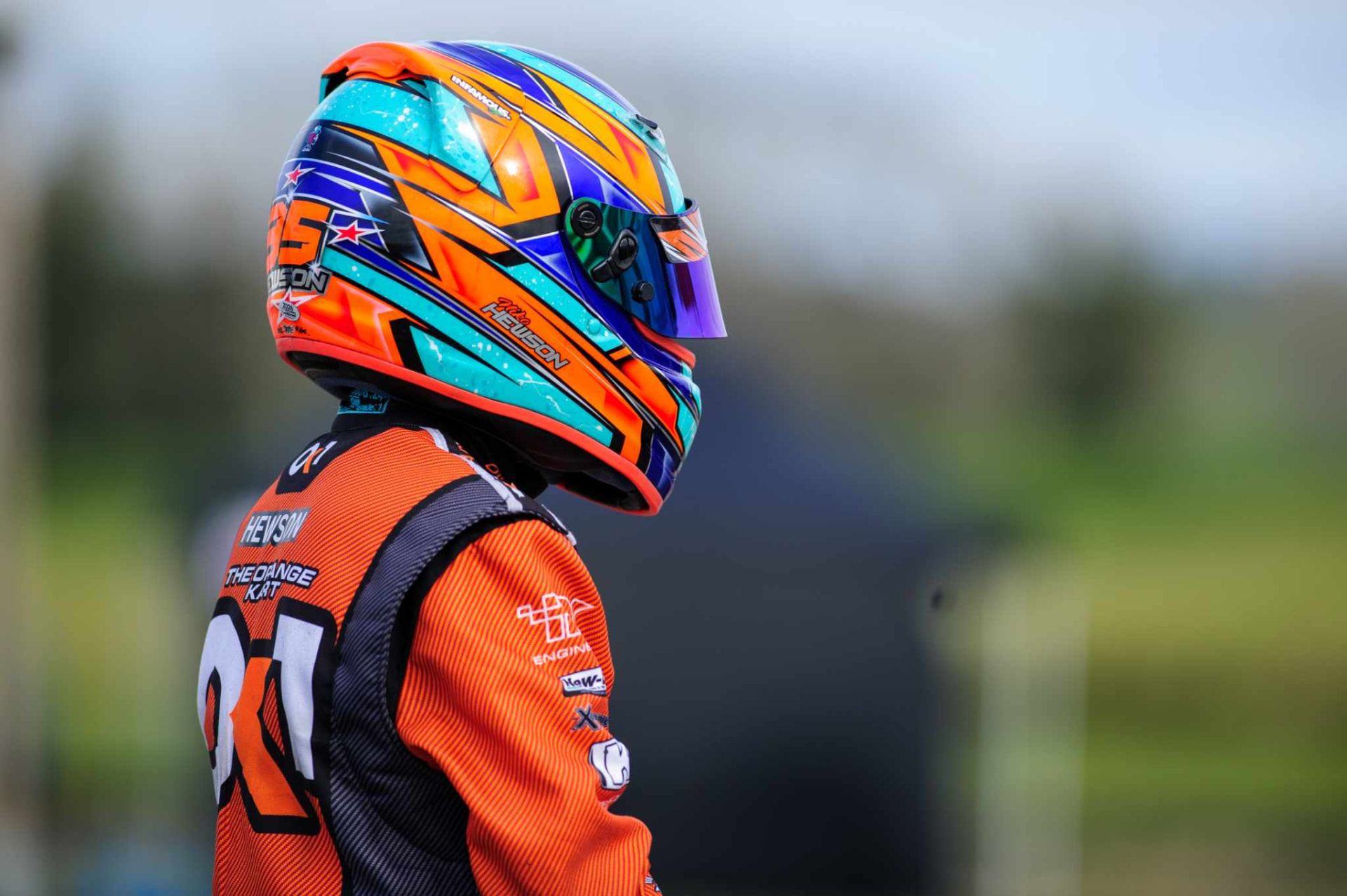 Niko Hewson in his #35 helmet and orange race suit