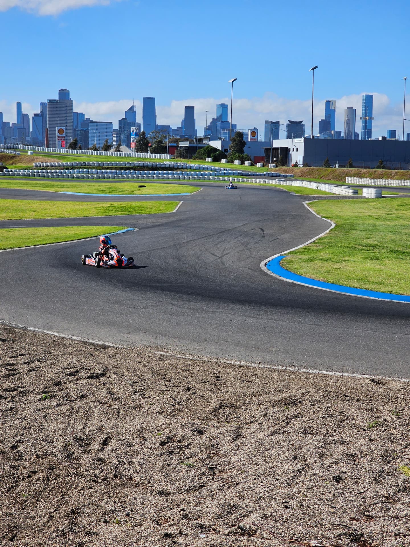 Niko Hewson racing in Australia with the Melbourne city skyline in the background