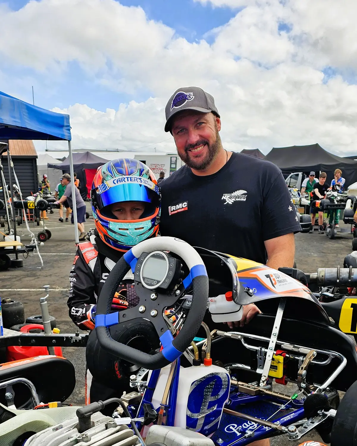 Niko in the kart with his dad in the pits