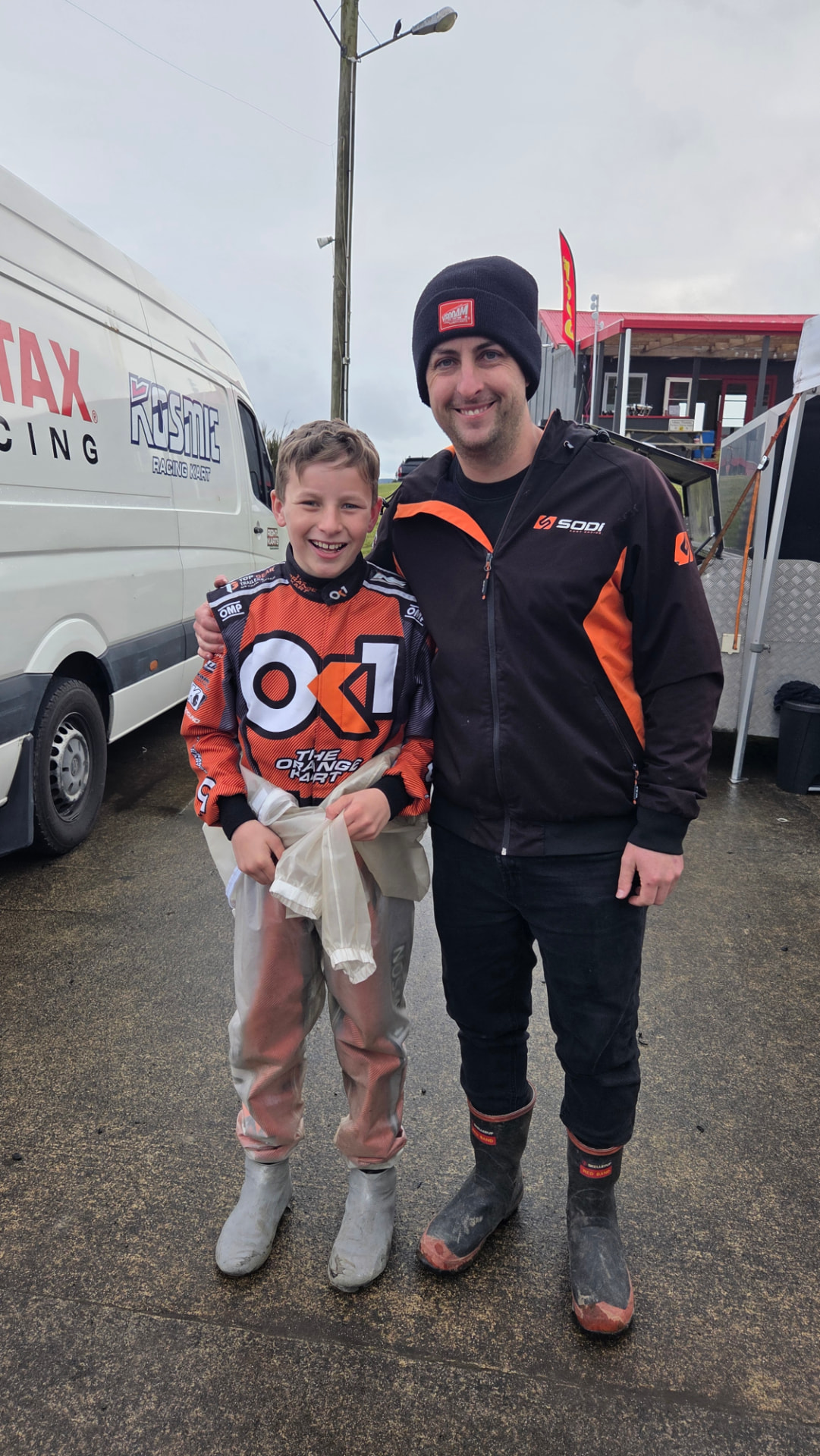 Niko with his dad Scotty at the track on a wet race day